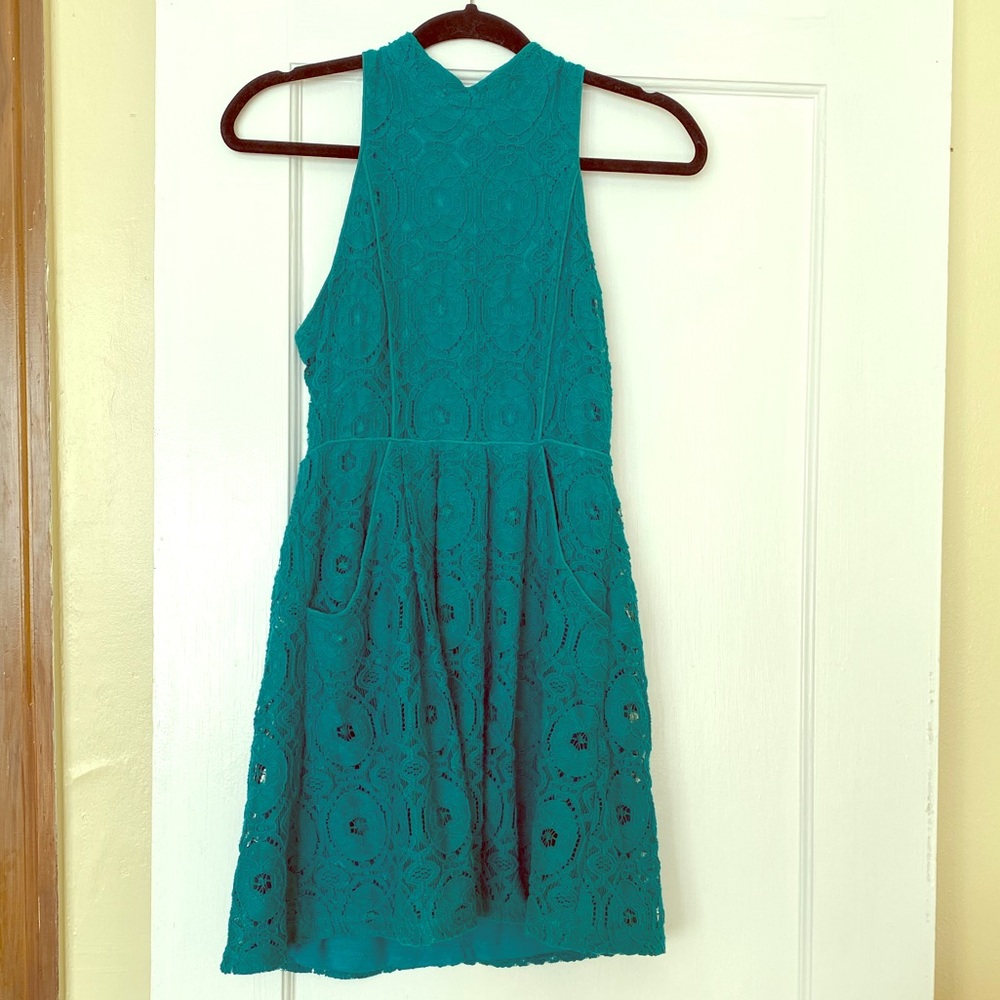 Backless teal lace dress with pockets